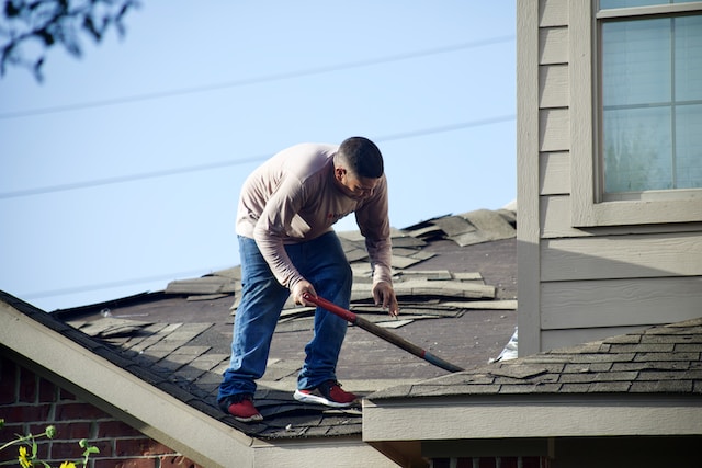 Man doing an emergency roof repair